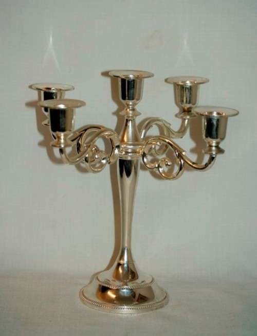 A fabulous tall 5-arm silver plated candelabra with ornate detailing and felt lined base