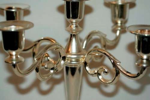 A fabulous tall 5-arm silver plated candelabra with ornate detailing and felt lined base