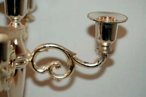A fabulous tall 5-arm silver plated candelabra with ornate detailing and felt lined base