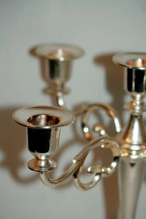 A fabulous tall 5-arm silver plated candelabra with ornate detailing and felt lined base