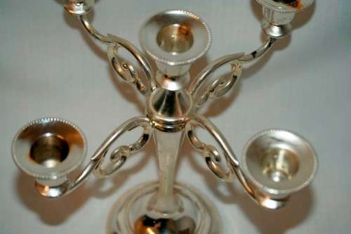 A fabulous tall 5-arm silver plated candelabra with ornate detailing and felt lined base