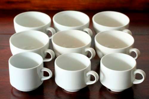 A fabulous collection of 9x white "Hotelware" porcelain tea & coffee cups in great condition - AAA