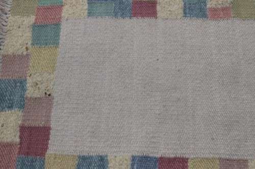 A stunning woven wool carpet in a soft pastel-colour block design, perfect bathroom rug - RS17Sale