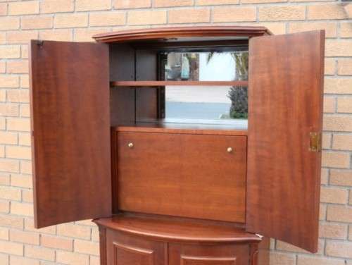 A stunning & stylish (tall) drinks cabinet with a fold-down serving shelf and loads of storage space
