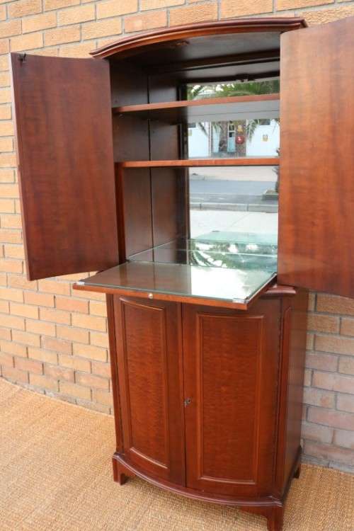 A stunning & stylish (tall) drinks cabinet with a fold-down serving shelf and loads of storage space