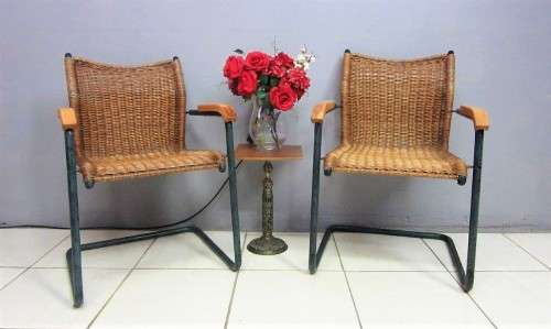 Two stunning wicker arm chairs in stunning condition - extra seating in the house - price/chair