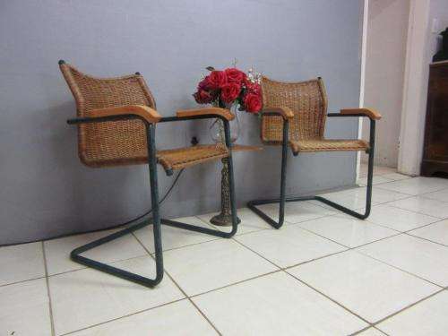 Two stunning wicker arm chairs in stunning condition - extra seating in the house - price/chair
