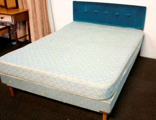 A stunning upholstered double-bed buttoned headboard with a Warner mattress & base.RS17Bed