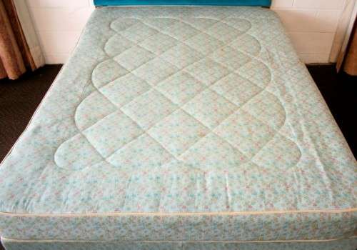 A stunning upholstered double-bed buttoned headboard with a Warner mattress & base.RS17Bed