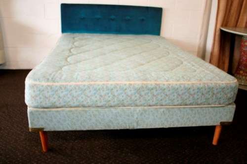 A stunning upholstered double-bed buttoned headboard with a Warner mattress & base.RS17Bed