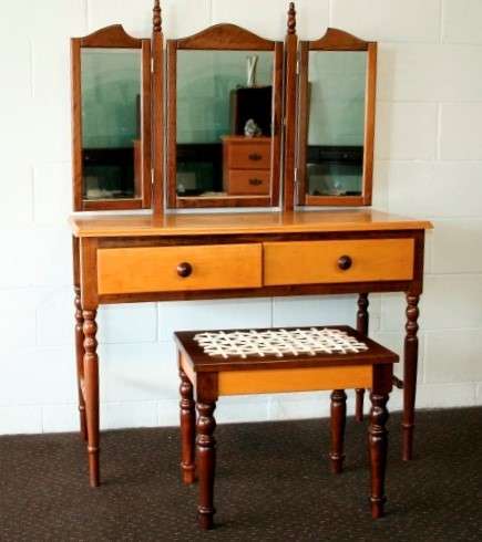 An exquisite two-drawer yellow wood & imbuia side-folding mirror dressing table with a riempie stool