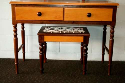 An exquisite two-drawer yellow wood & imbuia side-folding mirror dressing table with a riempie stool