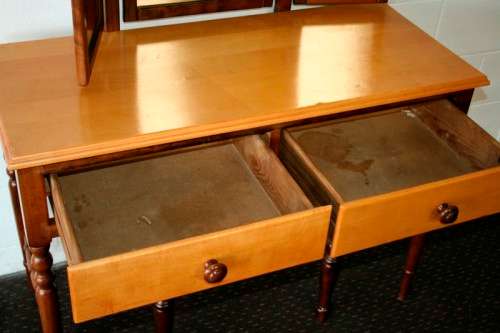 An exquisite two-drawer yellow wood & imbuia side-folding mirror dressing table with a riempie stool