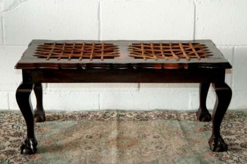 A stunning and well-made vintage solid imbuia ball & claw riempie foot stool with leather riempies
