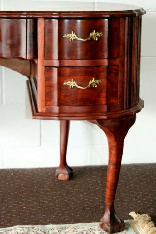 A stunning vintage solid Imbuia ball & claw kidney-shape "knee-hole" writing desk with five drawers