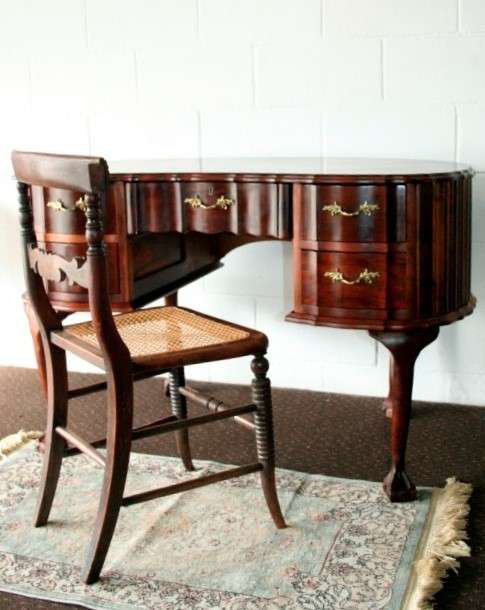 A stunning vintage solid Imbuia ball & claw kidney-shape "knee-hole" writing desk with five drawers