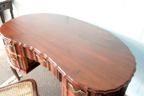 A stunning vintage solid Imbuia ball & claw kidney-shape "knee-hole" writing desk with five drawers