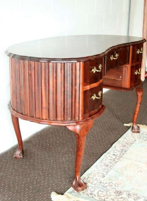 A stunning vintage solid Imbuia ball & claw kidney-shape "knee-hole" writing desk with five drawers