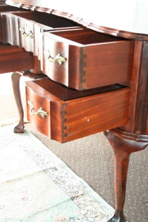 A stunning vintage solid Imbuia ball & claw kidney-shape "knee-hole" writing desk with five drawers