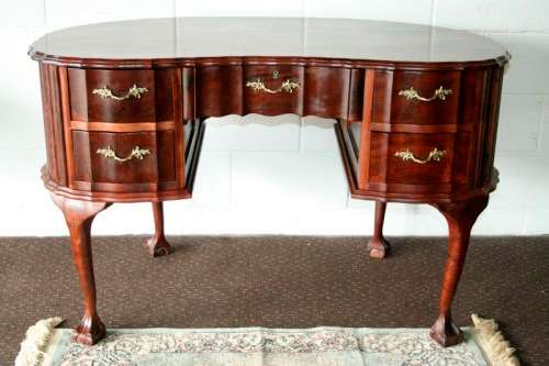 A stunning vintage solid Imbuia ball & claw kidney-shape "knee-hole" writing desk with five drawers