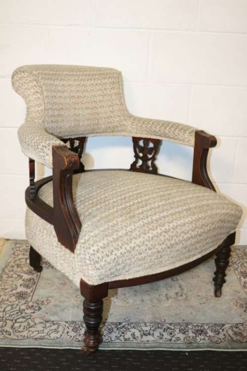 A wonderful antique Edwardian upholstered library armchair on its original castors - stunning!