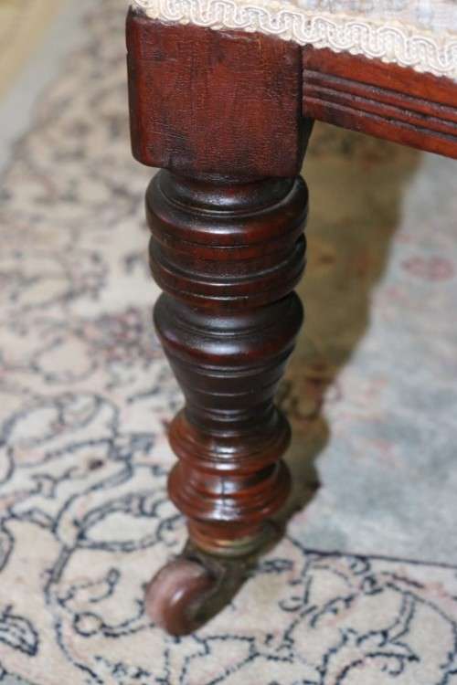 A wonderful antique Edwardian upholstered library armchair on its original castors - stunning!