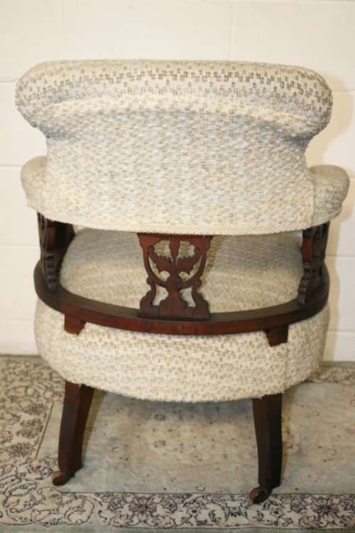 A wonderful antique Edwardian upholstered library armchair on its original castors - stunning!