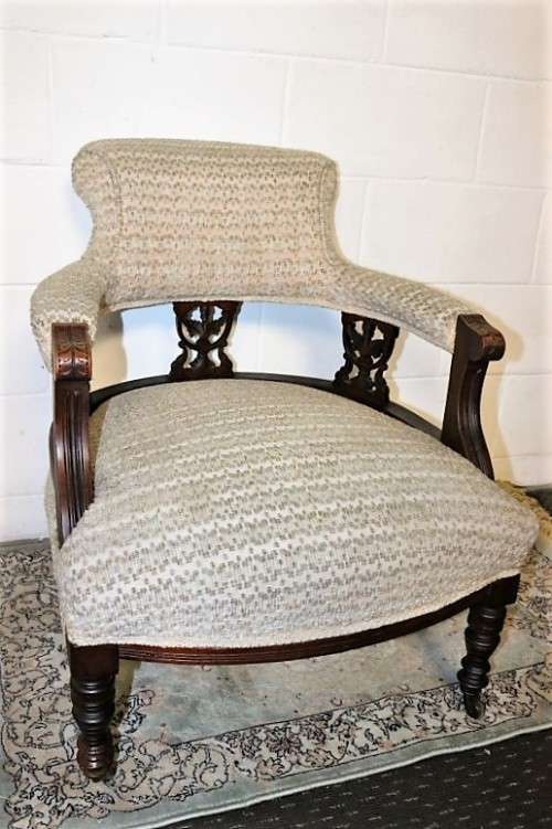 A wonderful antique Edwardian upholstered library armchair on its original castors - stunning!