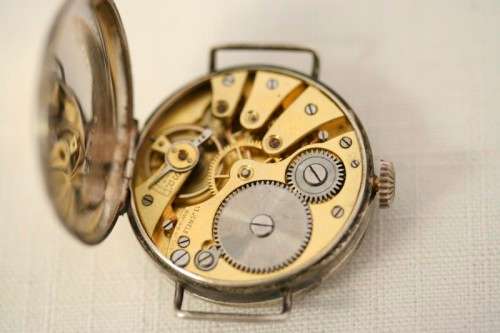An exquisite antique 13 Jewell Swiss made "Sentinel" gents sterling silver trench watch = Beautiful!