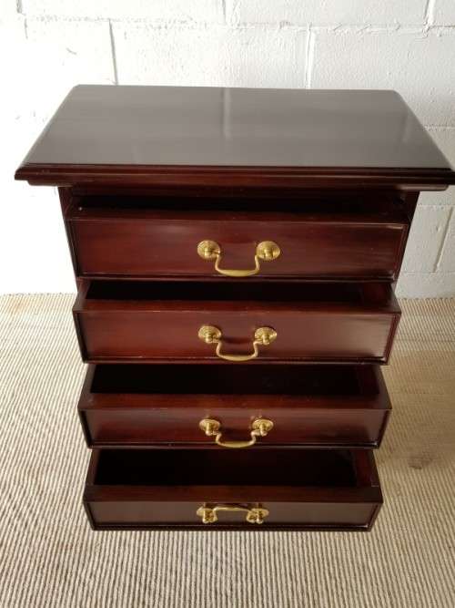 A wonderful Mahogany four-drawer pedestal/ chest of drawers with brass handles in good condition