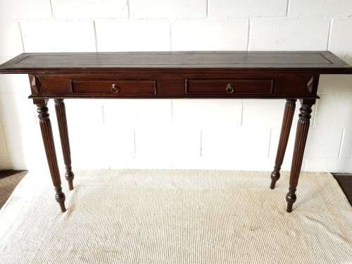 An amazing vintage two-drawer hallway table w fluted legs and lovely hand carved detailing