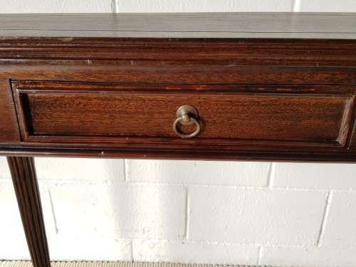 An amazing vintage two-drawer hallway table w fluted legs and lovely hand carved detailing