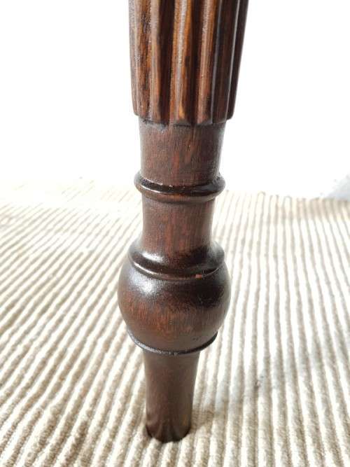 An amazing vintage two-drawer hallway table w fluted legs and lovely hand carved detailing