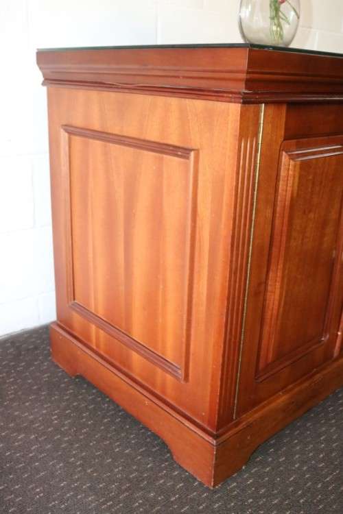 A wonderful Mahogany mini bar cabinet with shelves inside and a removable glass top on castors