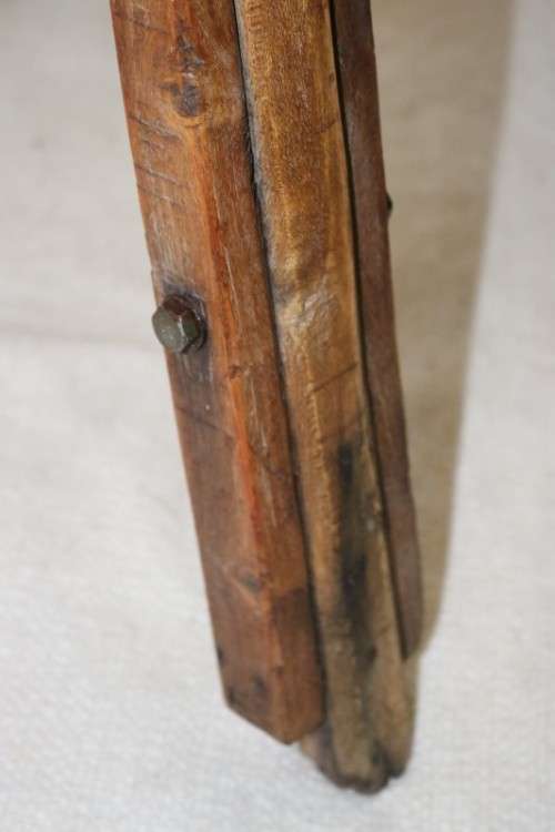 A fantastic antique metal and wood surveyor tripod in good condition for its impressive age