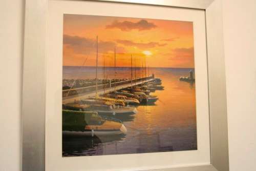 A stunning and vibrant framed painting print of sailing boats tied to a quay at sunset - RS17Sale