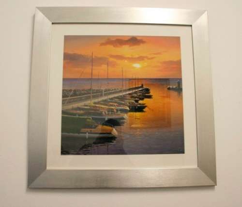 A stunning and vibrant framed painting print of sailing boats tied to a quay at sunset - RS17Sale