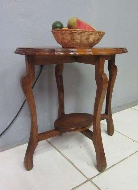 A gorgeous and stylish vintage solid teak oval occasional coffee table with scalloped style edges