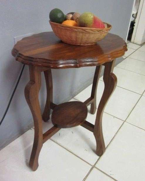 A gorgeous and stylish vintage solid teak oval occasional coffee table with scalloped style edges