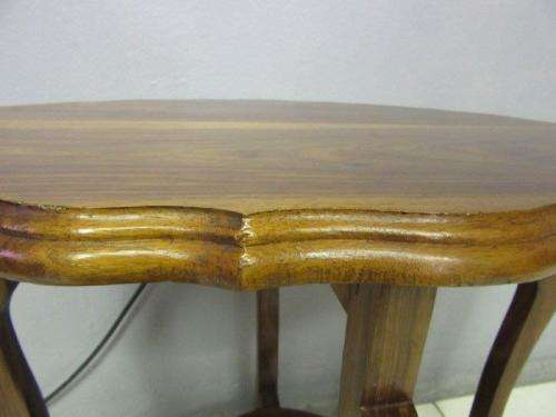 A gorgeous and stylish vintage solid teak oval occasional coffee table with scalloped style edges