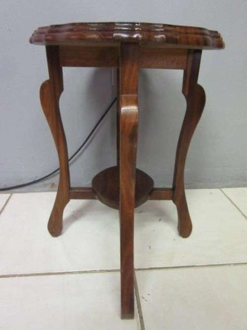 A gorgeous and stylish vintage solid teak oval occasional coffee table with scalloped style edges