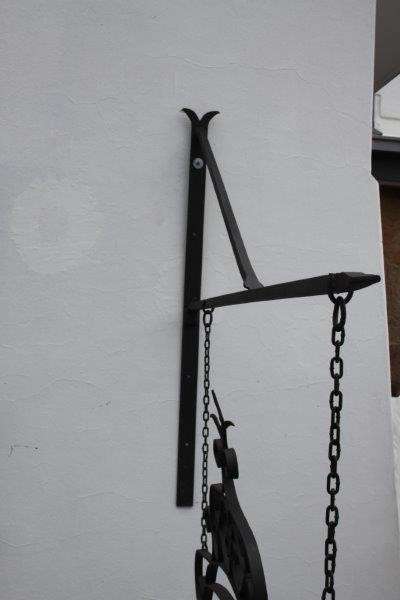 An awesome large wrought iron "Barney's Pub, Gold Reef City" signage wall frame with the bracket