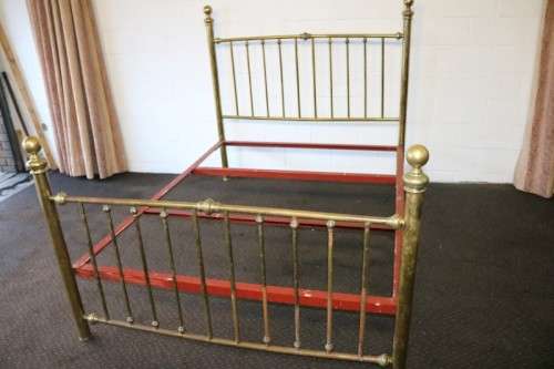 An amazing vintage Queen-size brass bed with a stunning brass headboard and footboard.RS17Bed