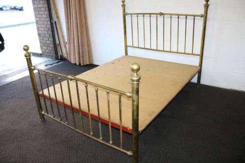 An amazing vintage Queen-size brass bed with a stunning brass headboard and footboard.RS17Bed