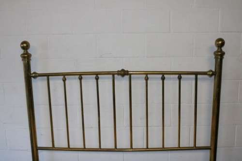 An amazing vintage Queen-size brass bed with a stunning brass headboard and footboard.RS17Bed