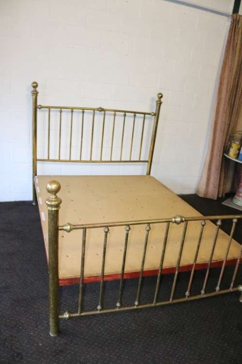 An amazing vintage Queen-size brass bed with a stunning brass headboard and footboard.RS17Bed