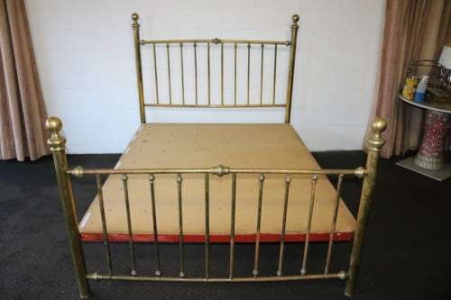 An amazing vintage Queen-size brass bed with a stunning brass headboard and footboard.RS17Bed