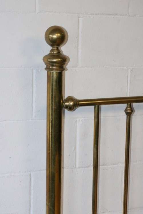 An amazing vintage Queen-size brass bed with a stunning brass headboard and footboard.RS17Bed