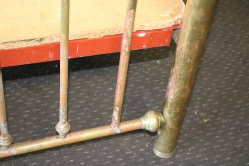 An amazing vintage Queen-size brass bed with a stunning brass headboard and footboard.RS17Bed