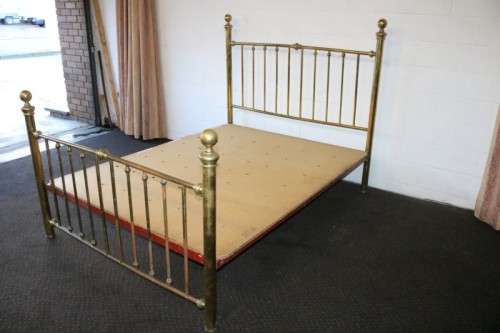 An amazing vintage Queen-size brass bed with a stunning brass headboard and footboard.RS17Bed